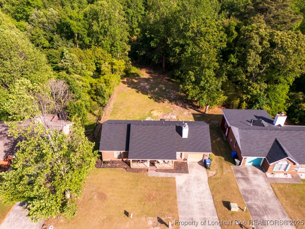 5014 Summer Ridge Road Fayetteville, NC 28303 - Photo 5 of 20 an aerial view of a house with swimming pool and large trees
