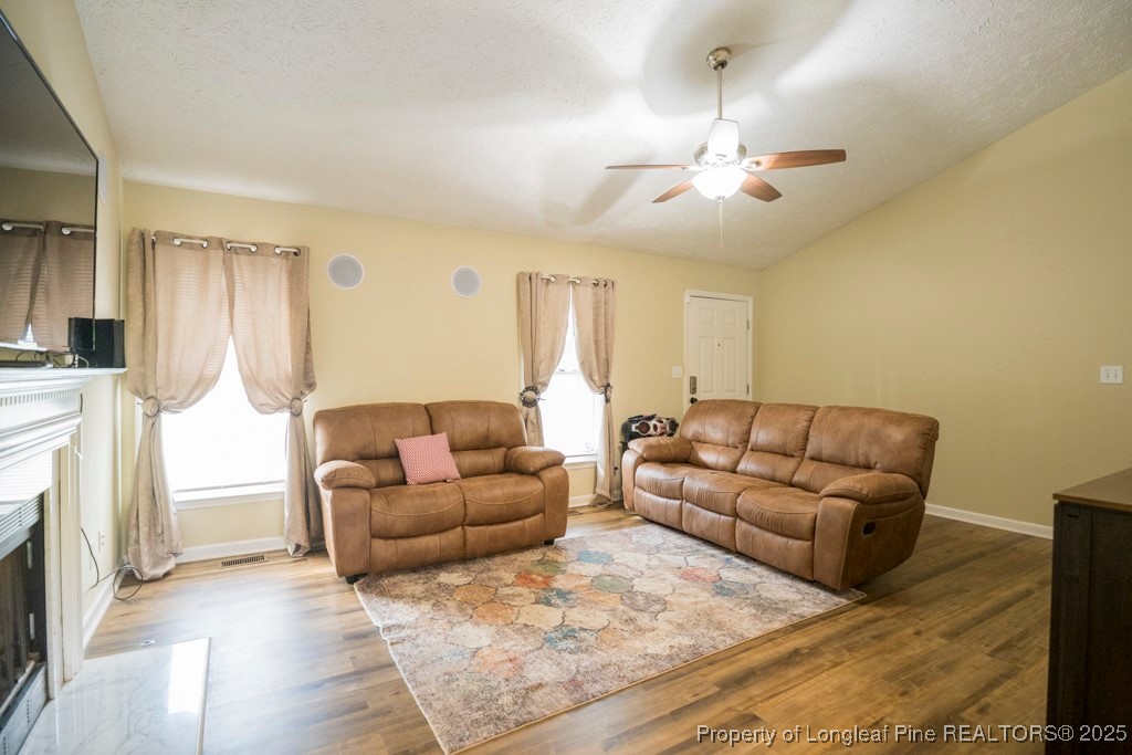 5014 Summer Ridge Road Fayetteville, NC 28303 - Photo 7 of 20 a living room with furniture and a fireplace