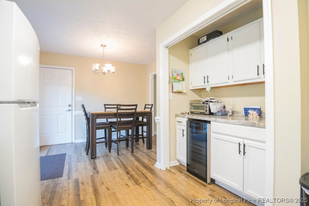 5014 Summer Ridge Road Fayetteville, NC 28303 - Photo 9 of 20 a kitchen with a table and chairs in it