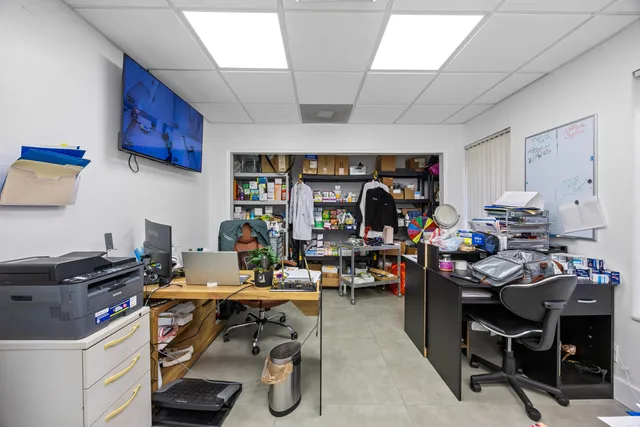 a view of a workspace with furniture