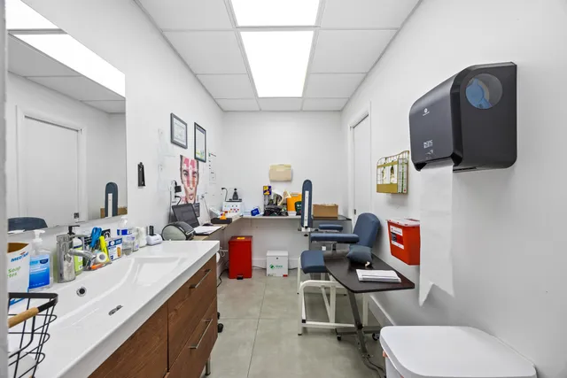 a room with furniture a rug toys and a window