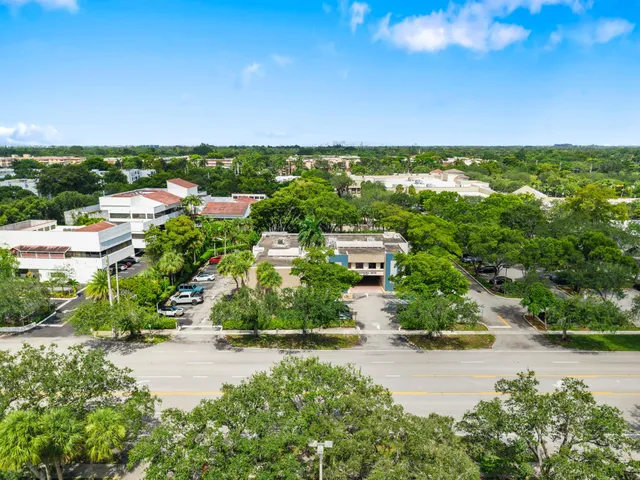 an aerial view of multiple house with yard
