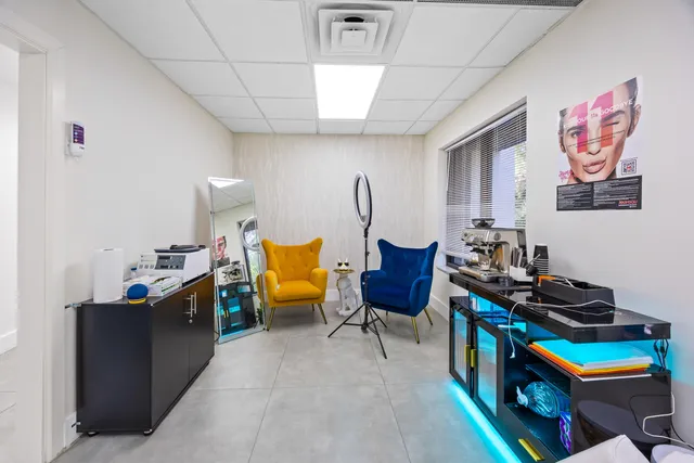 a bed room with furniture and a chair