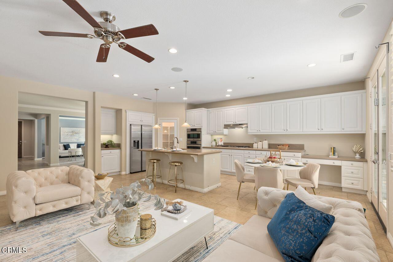 11249 Figtree Terrace Road Corona, CA 92883 - Photo 13 of 53 a living room with stainless steel appliances furniture and a view of kitchen