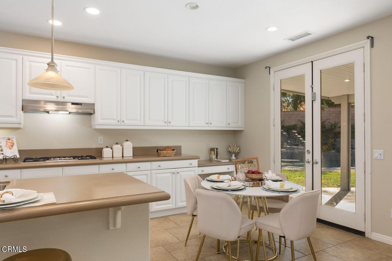 11249 Figtree Terrace Road Corona, CA 92883 - Photo 15 of 53 a kitchen with a sink cabinets and window