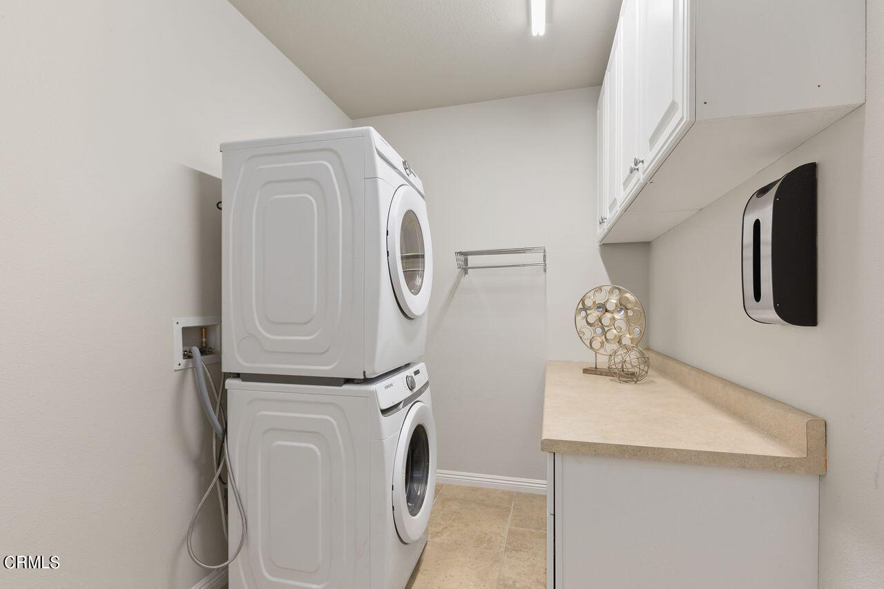 11249 Figtree Terrace Road Corona, CA 92883 - Photo 22 of 53 a utility room with dryer and washer