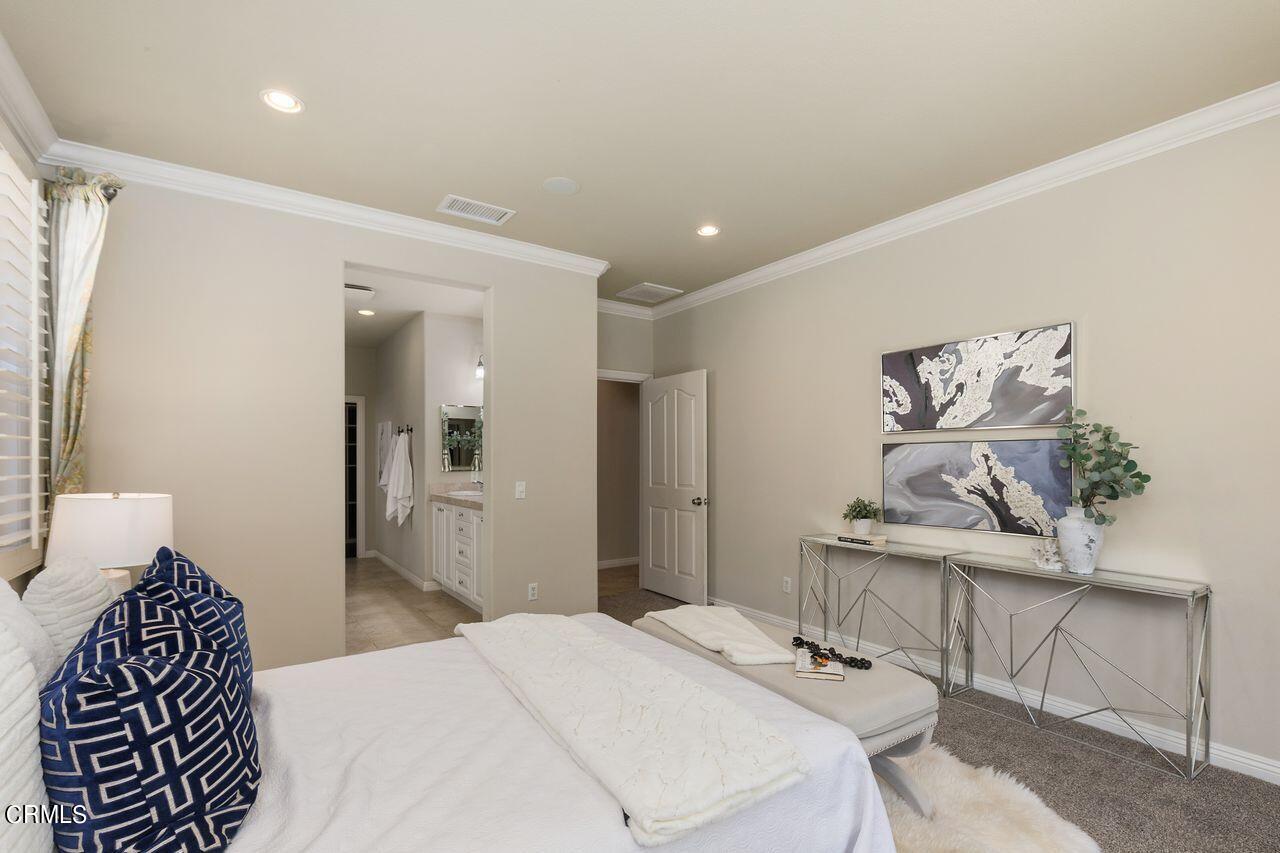 11249 Figtree Terrace Road Corona, CA 92883 - Photo 24 of 53 a bedroom with a bed and wooden floor