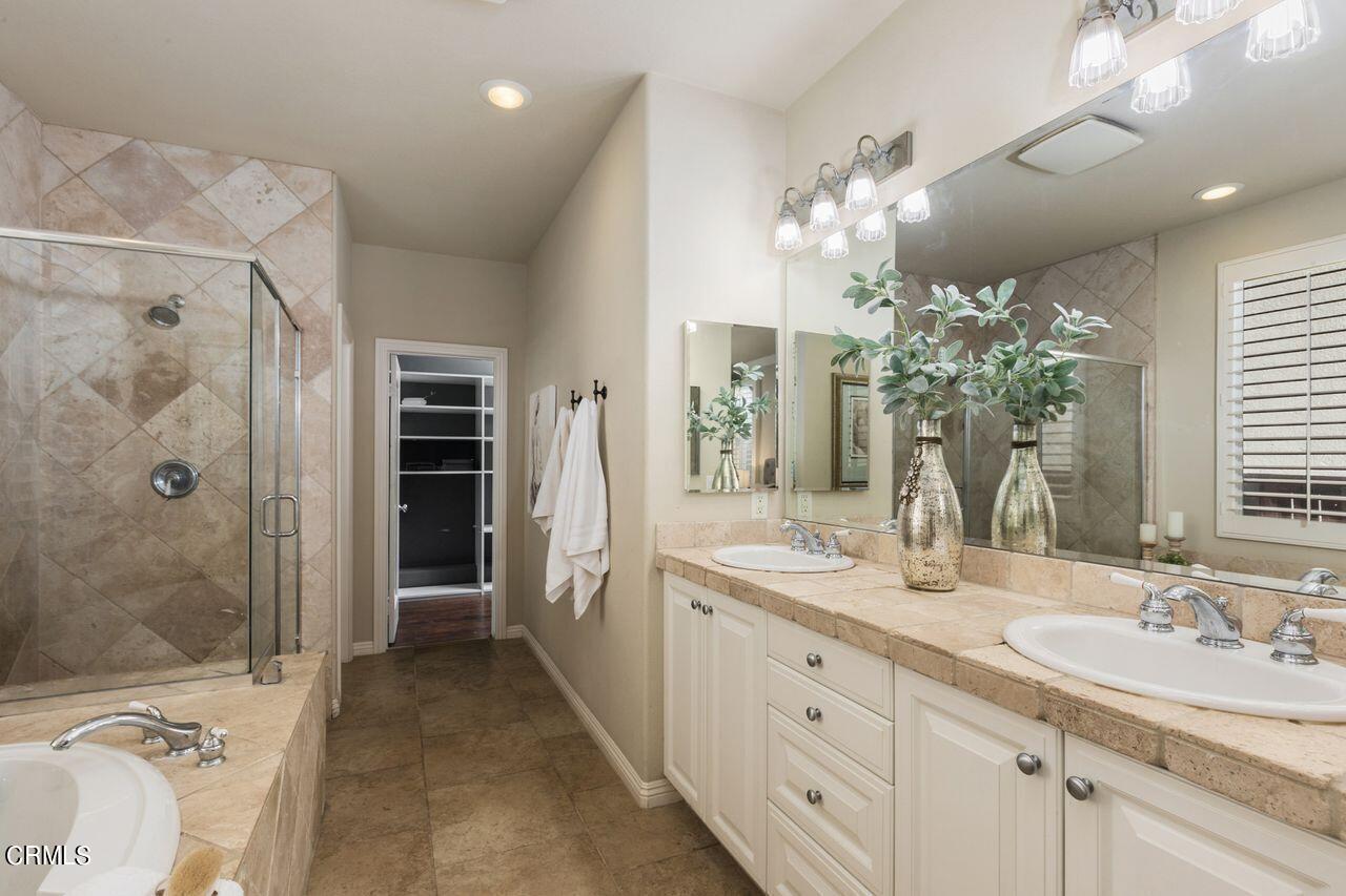 11249 Figtree Terrace Road Corona, CA 92883 - Photo 25 of 53 a spacious bathroom with a double vanity sink mirror and shower
