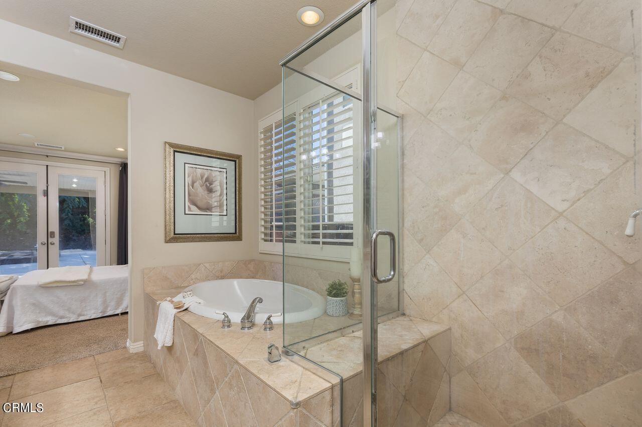 11249 Figtree Terrace Road Corona, CA 92883 - Photo 27 of 53 a bathroom with a tub and shower