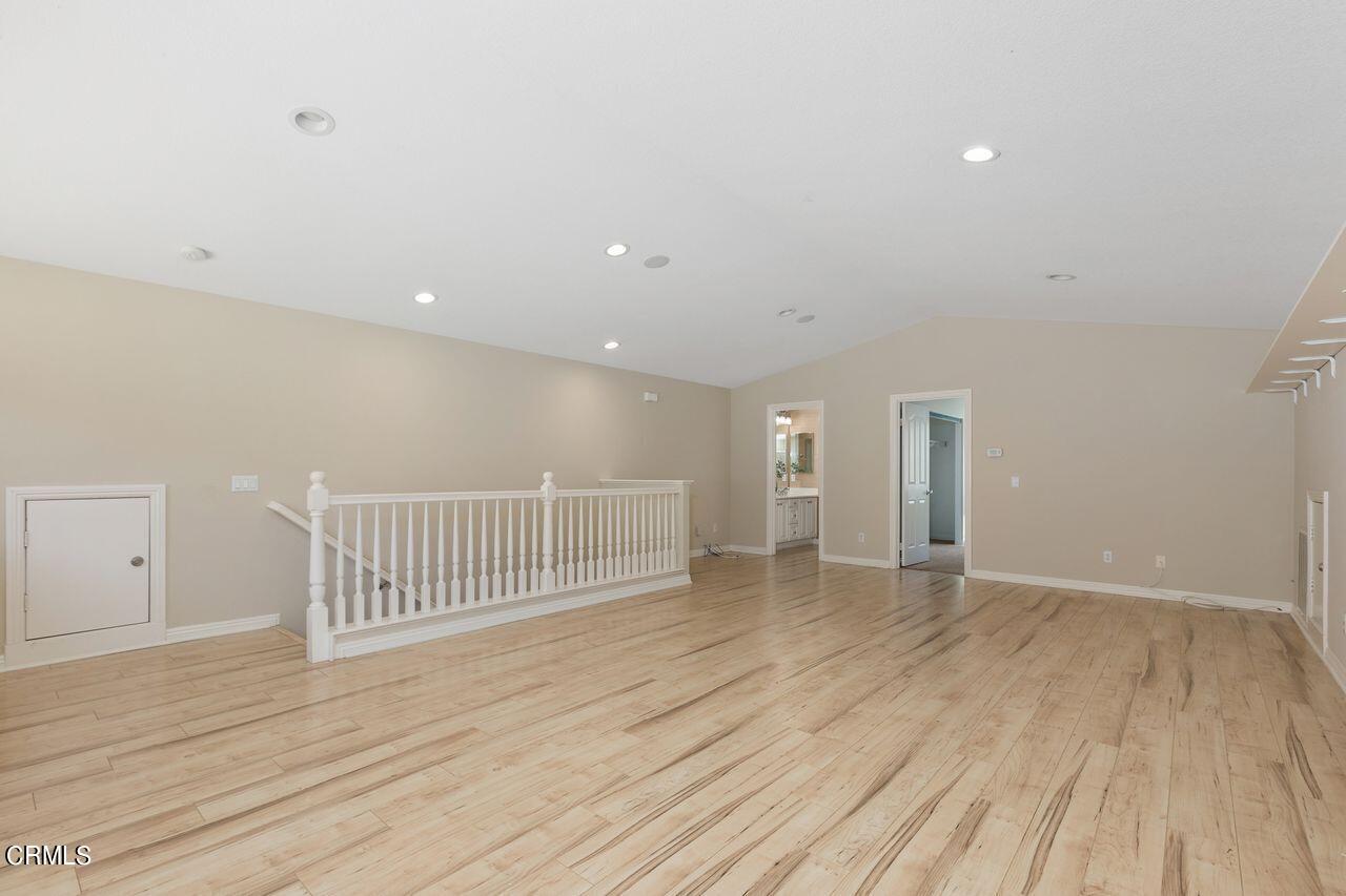 11249 Figtree Terrace Road Corona, CA 92883 - Photo 29 of 53 an empty room with wooden floor and windows