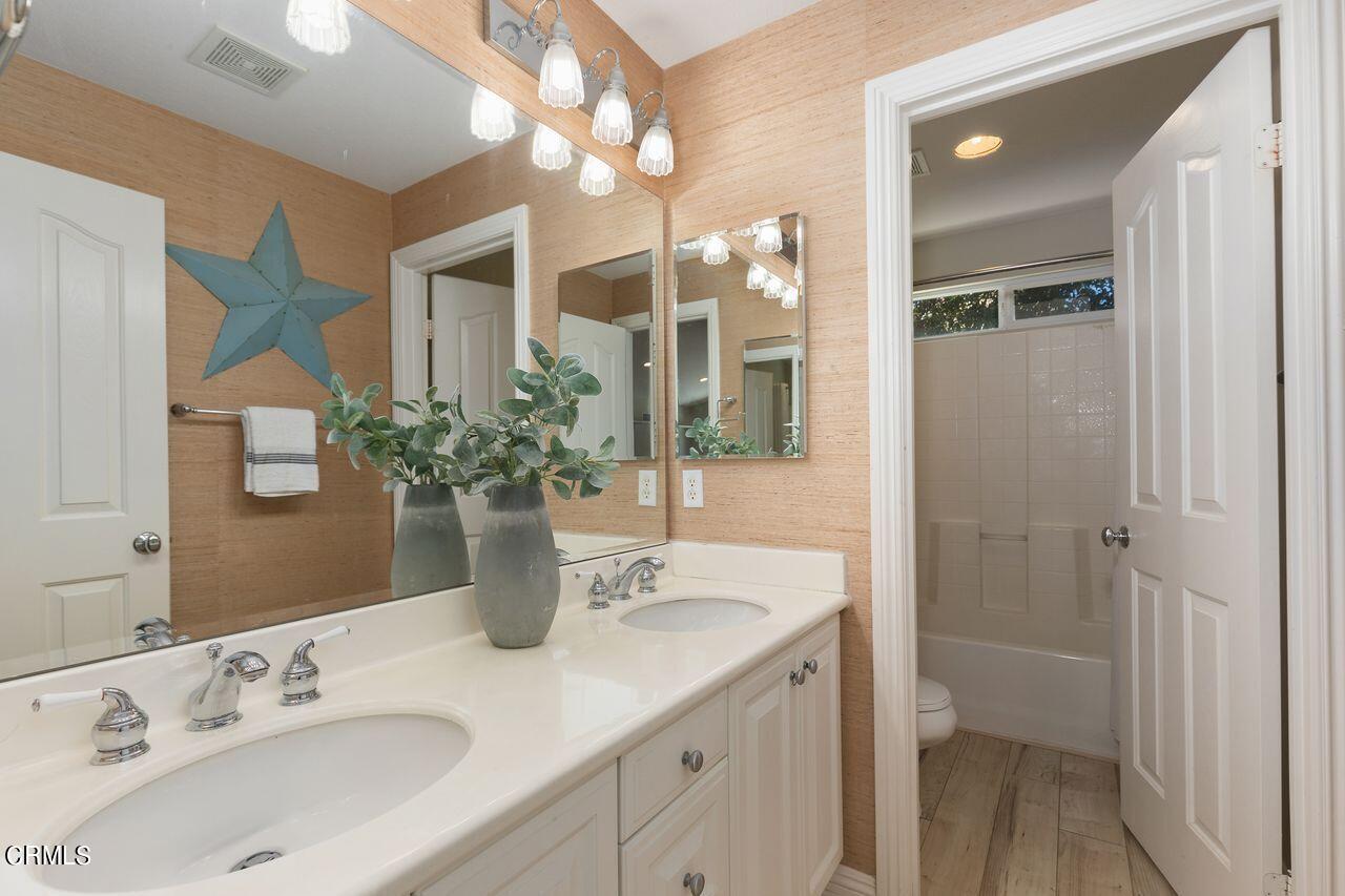 11249 Figtree Terrace Road Corona, CA 92883 - Photo 31 of 53 a bathroom with a sink and a mirror
