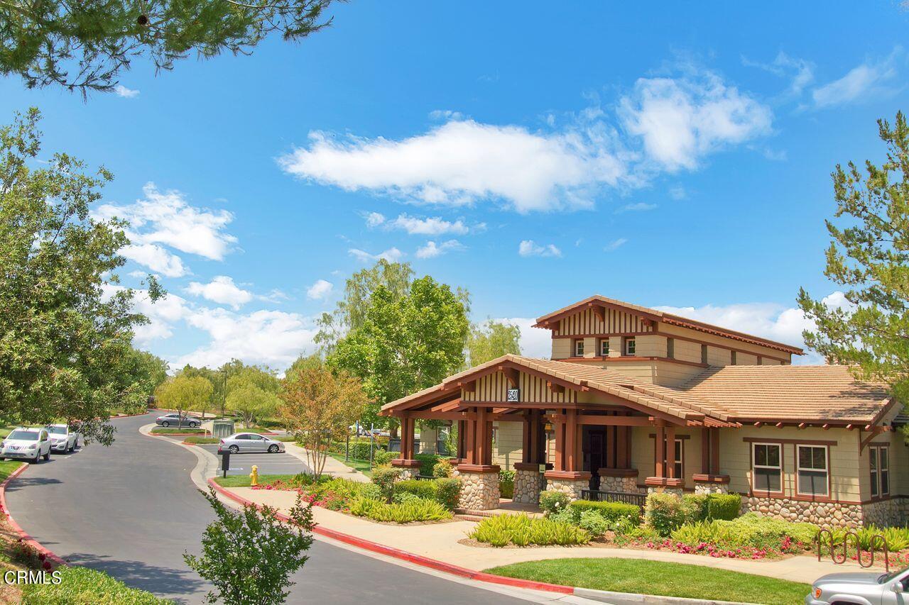 11249 Figtree Terrace Road Corona, CA 92883 - Photo 42 of 53 a front view of a house with a yard table and chairs