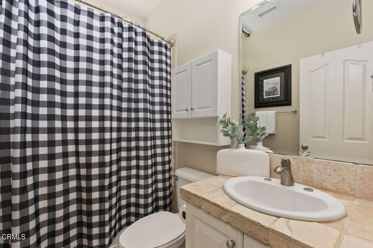11249 Figtree Terrace Road Corona, CA 92883 - Photo 5 of 53 a bathroom with a sink toilet and mirror