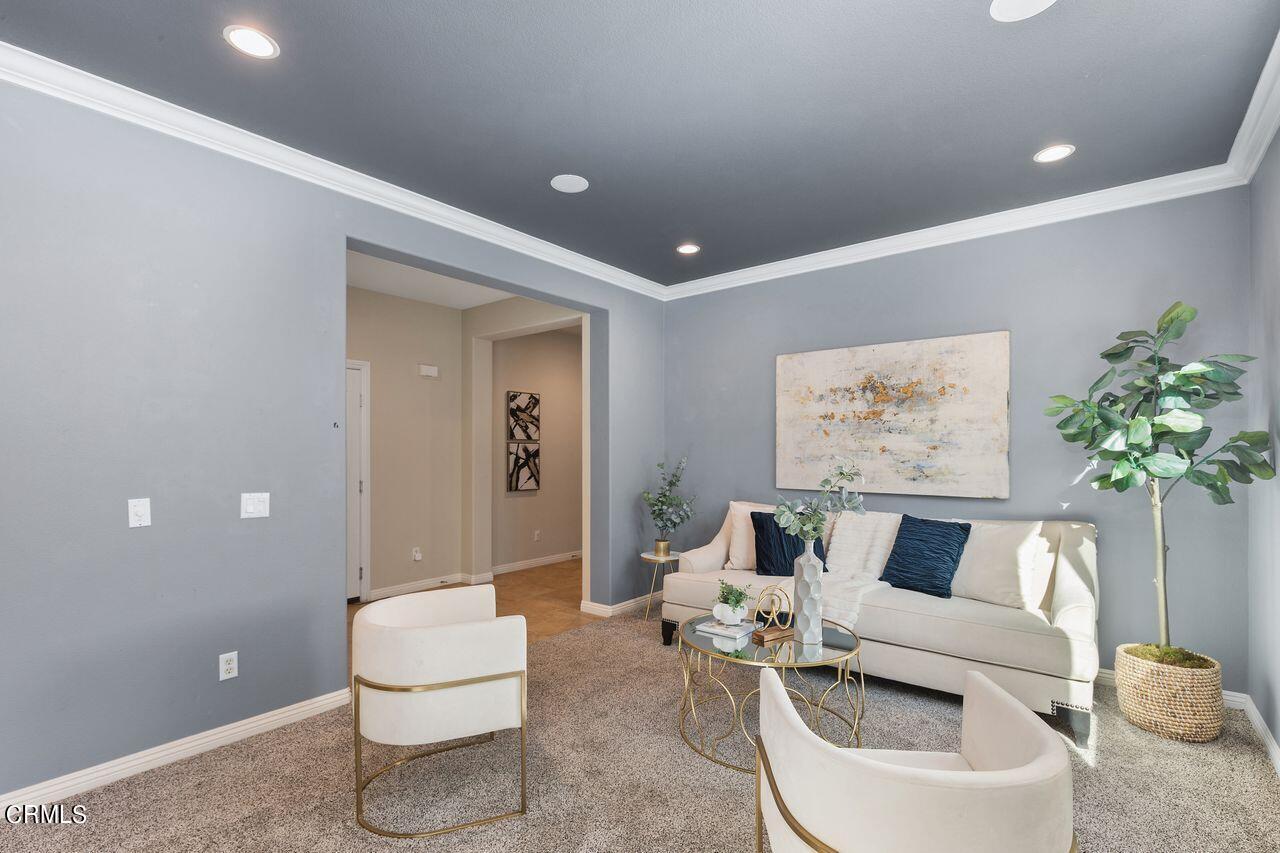 11249 Figtree Terrace Road Corona, CA 92883 - Photo 7 of 53 a living room with furniture and a toilet