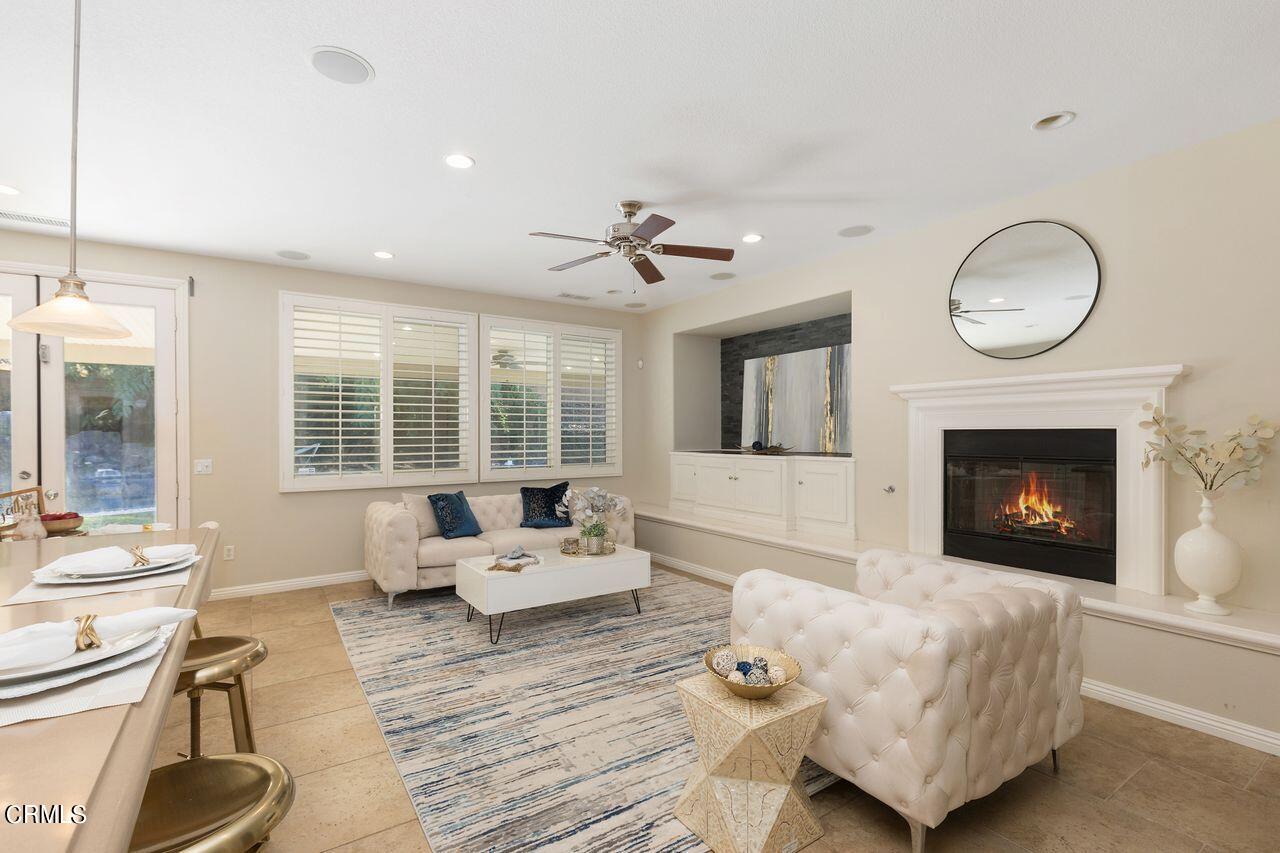 11249 Figtree Terrace Road Corona, CA 92883 - Photo 10 of 53 a living room with furniture and a fireplace