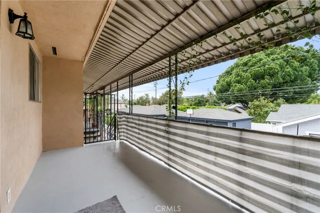 a view of street with balcony
