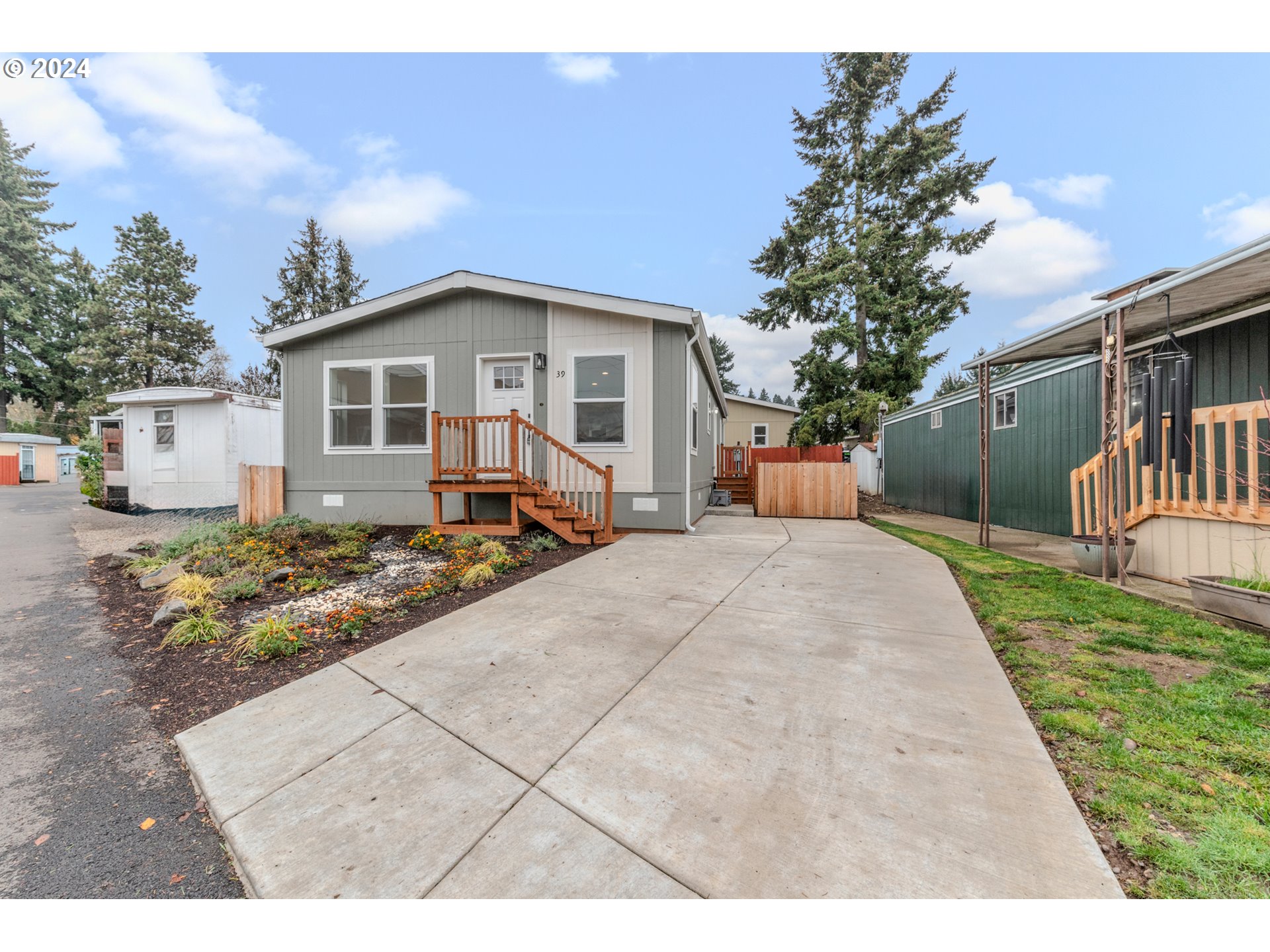9700 Southwest Tualatin Road, Unit 39 Tualatin, OR 97062 - Photo 28 of 28 a front view of a house with a yard and outdoor seating