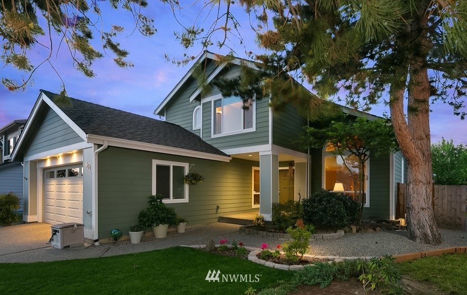 932 South 32nd Place Renton, WA 98055 - Photo 1 of 31 a front view of a house with a yard