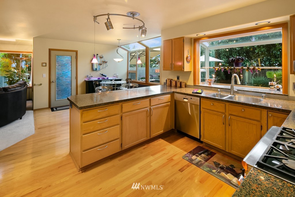 932 South 32nd Place Renton, WA 98055 - Photo 12 of 31 a kitchen with a sink appliances and cabinets