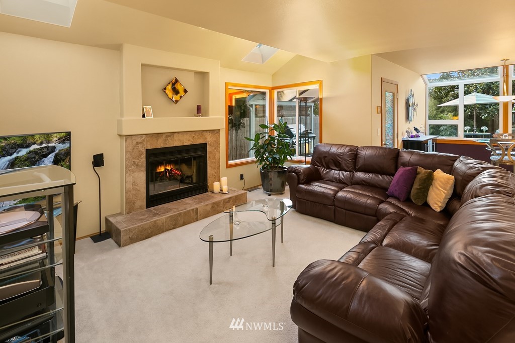 932 South 32nd Place Renton, WA 98055 - Photo 15 of 31 a living room with furniture and a fireplace