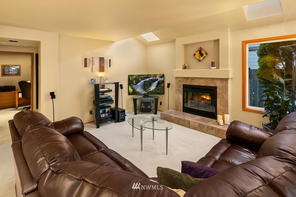 932 South 32nd Place Renton, WA 98055 - Photo 16 of 31 a living room with furniture and a fireplace