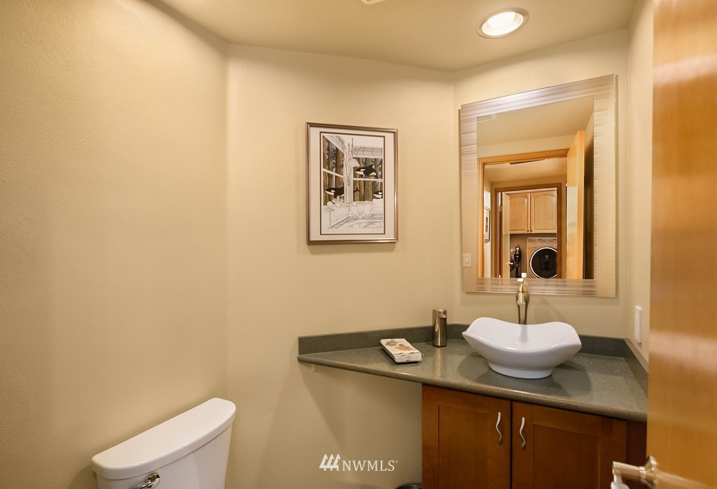 932 South 32nd Place Renton, WA 98055 - Photo 18 of 31 a bathroom with a sink and a mirror