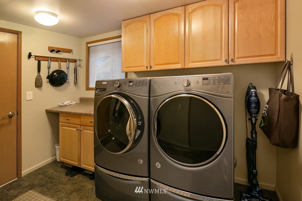 932 South 32nd Place Renton, WA 98055 - Photo 19 of 31 a utility room with dryer and washer