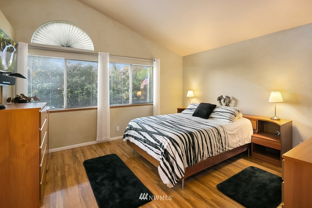 932 South 32nd Place Renton, WA 98055 - Photo 21 of 31 a bedroom with a bed and wooden floor