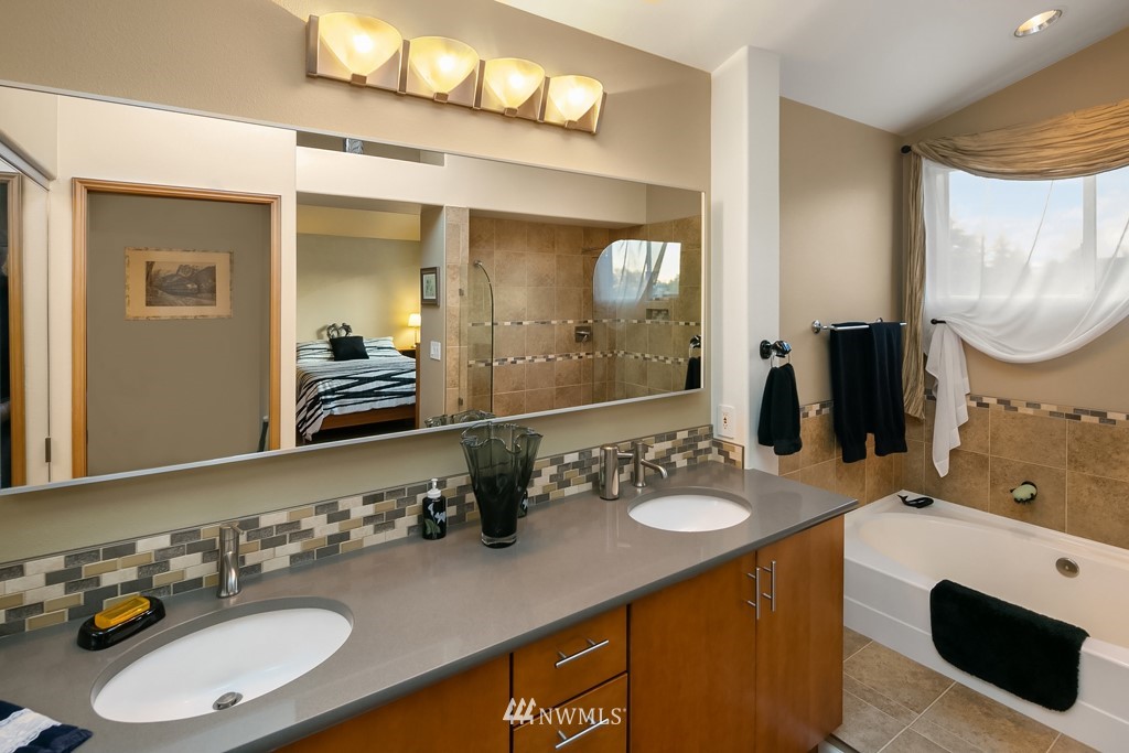 932 South 32nd Place Renton, WA 98055 - Photo 22 of 31 a bathroom with a sink double vanity and a mirror