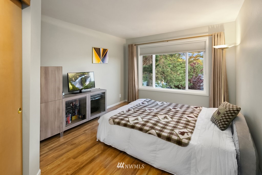 932 South 32nd Place Renton, WA 98055 - Photo 25 of 31 a bedroom with a bed and a window in it
