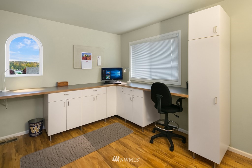 932 South 32nd Place Renton, WA 98055 - Photo 26 of 31 a view of a workspace with furniture and a window