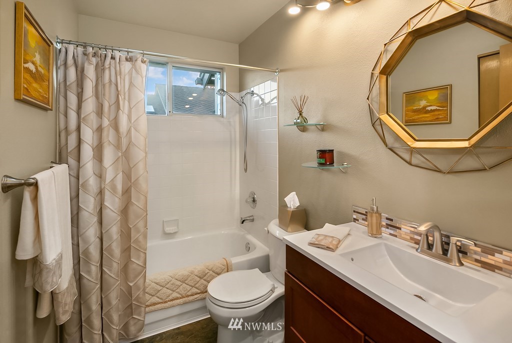 932 South 32nd Place Renton, WA 98055 - Photo 27 of 31 a bathroom with a sink toilet and shower