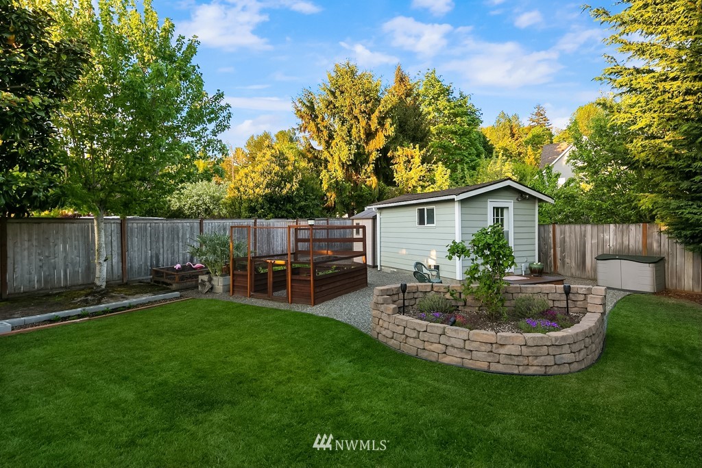 932 South 32nd Place Renton, WA 98055 - Photo 29 of 31 a view of a house with backyard and sitting area