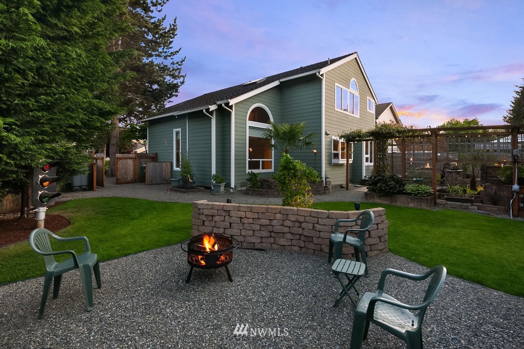 932 South 32nd Place Renton, WA 98055 - Photo 4 of 31 a front view of a house with a yard and outdoor seating