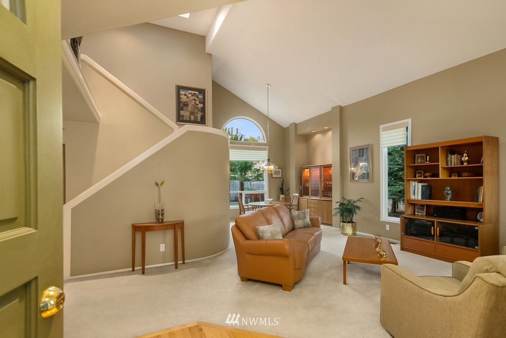 932 South 32nd Place Renton, WA 98055 - Photo 6 of 31 a living room with furniture and a book shelf