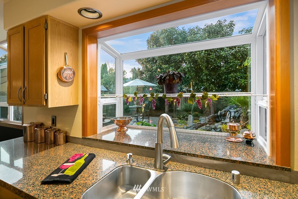 932 South 32nd Place Renton, WA 98055 - Photo 10 of 31 a kitchen with a large window and a sink