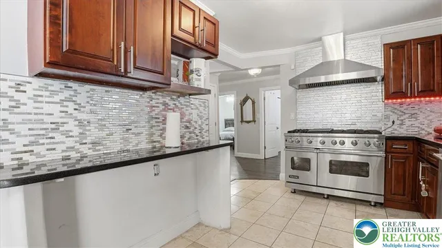 a living room with furniture and a kitchen view
