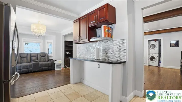 a view of a livingroom with wooden floor and stairs