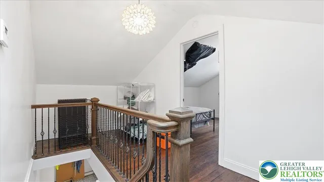 a room with a bed and a flat screen tv