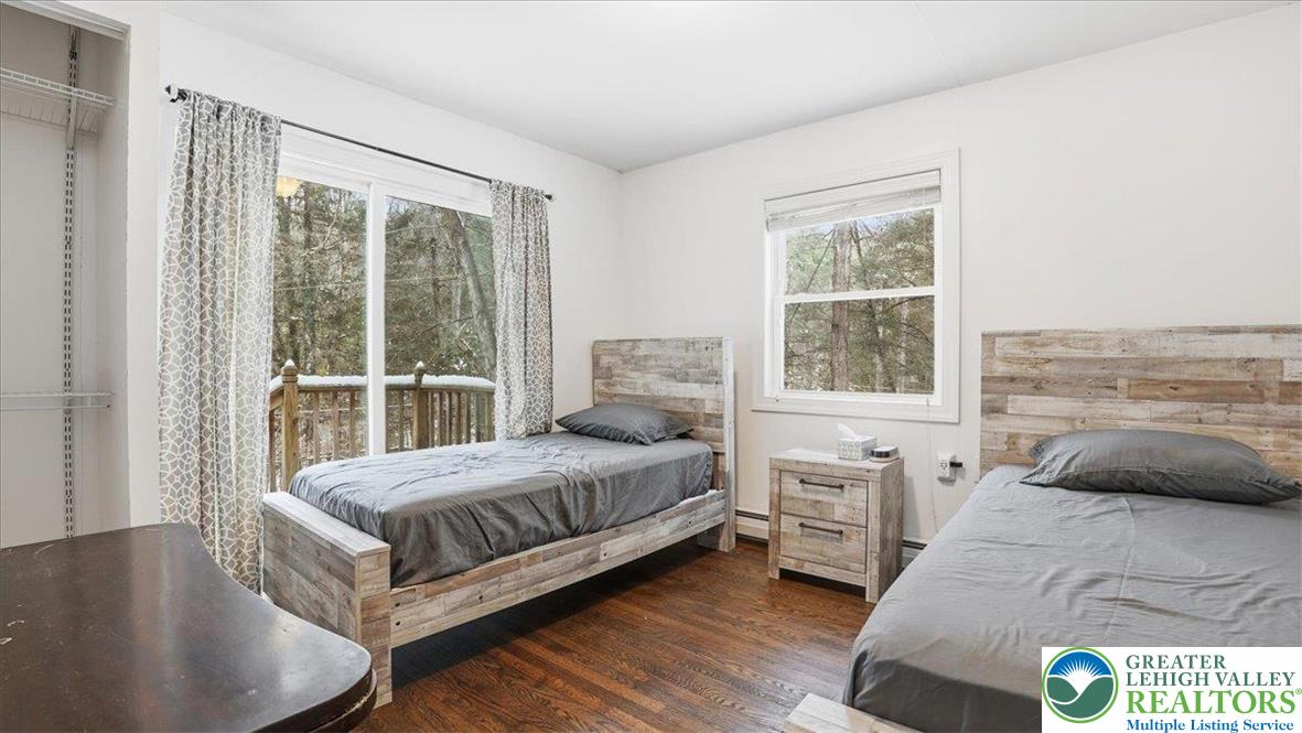 172 Evergreen Hollow Road Effort, PA 18330 - Photo 26 of 70 a bedroom with a bed and a large window