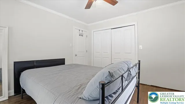 a bathroom with a sink toilet vanity and shower
