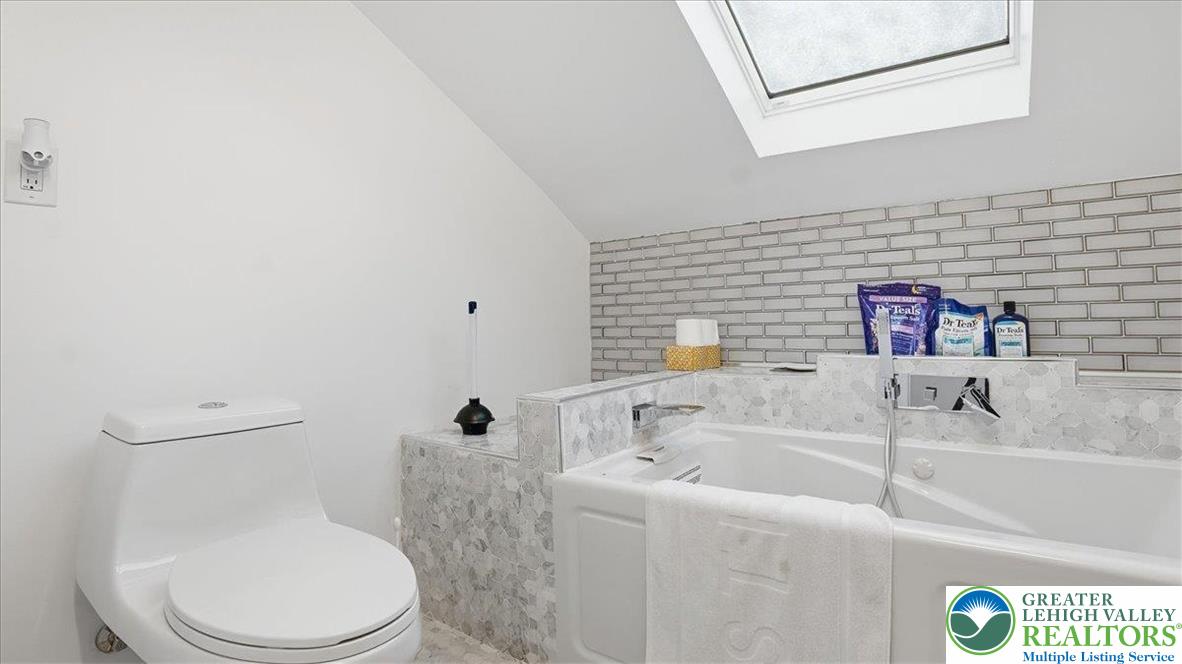 172 Evergreen Hollow Road Effort, PA 18330 - Photo 39 of 70 a white toilet sitting next to a bathroom sink