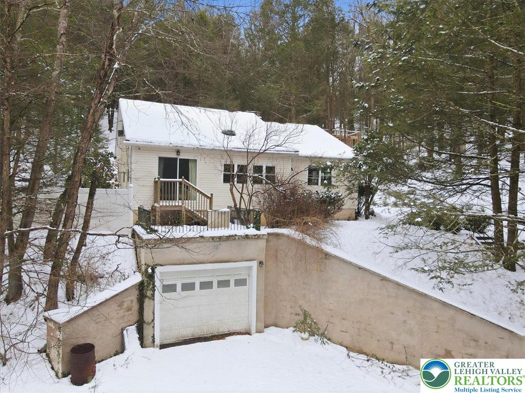 172 Evergreen Hollow Road Effort, PA 18330 - Photo 6 of 70 a view of a backyard with a patio and fire pit