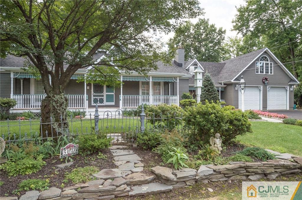5 Utica Road Edison, NJ 08820 - Photo 1 of 48 a front view of a house with garden