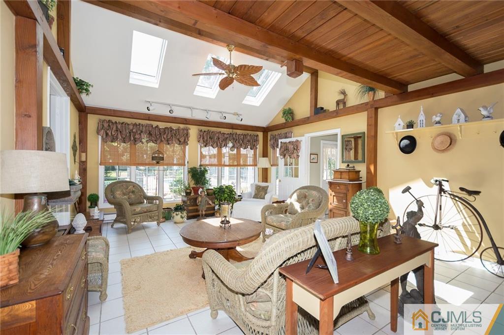 5 Utica Road Edison, NJ 08820 - Photo 12 of 48 a dining room with furniture and chandelier
