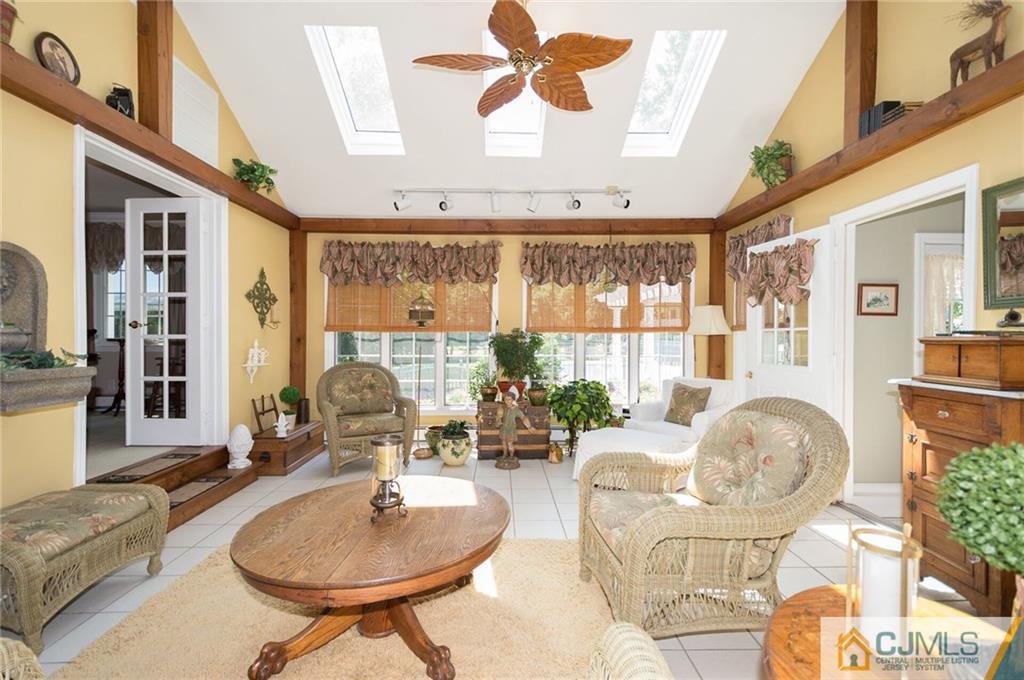 5 Utica Road Edison, NJ 08820 - Photo 13 of 48 a living room with furniture and a floor to ceiling window