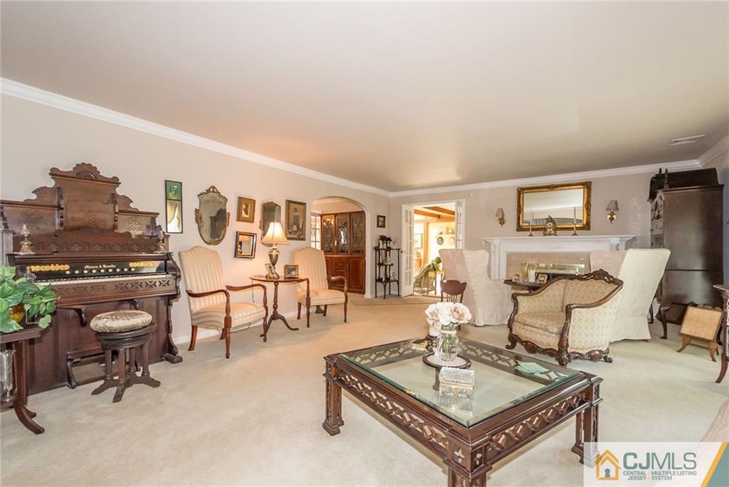 5 Utica Road Edison, NJ 08820 - Photo 14 of 48 a living room with furniture and a table