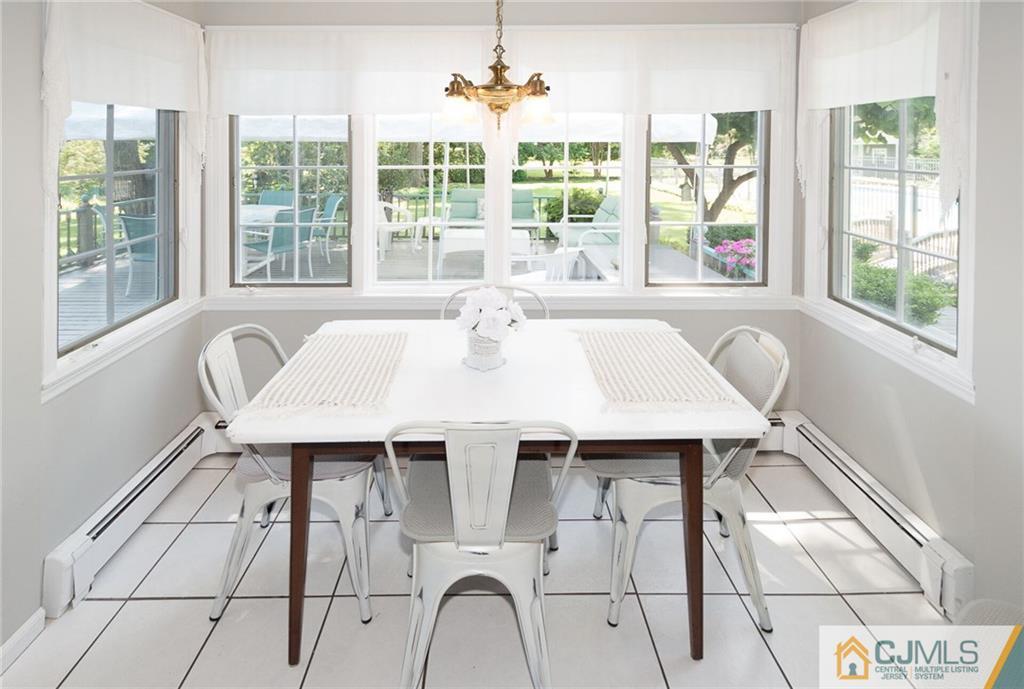 5 Utica Road Edison, NJ 08820 - Photo 16 of 48 a view of a dining room with furniture window and outside view