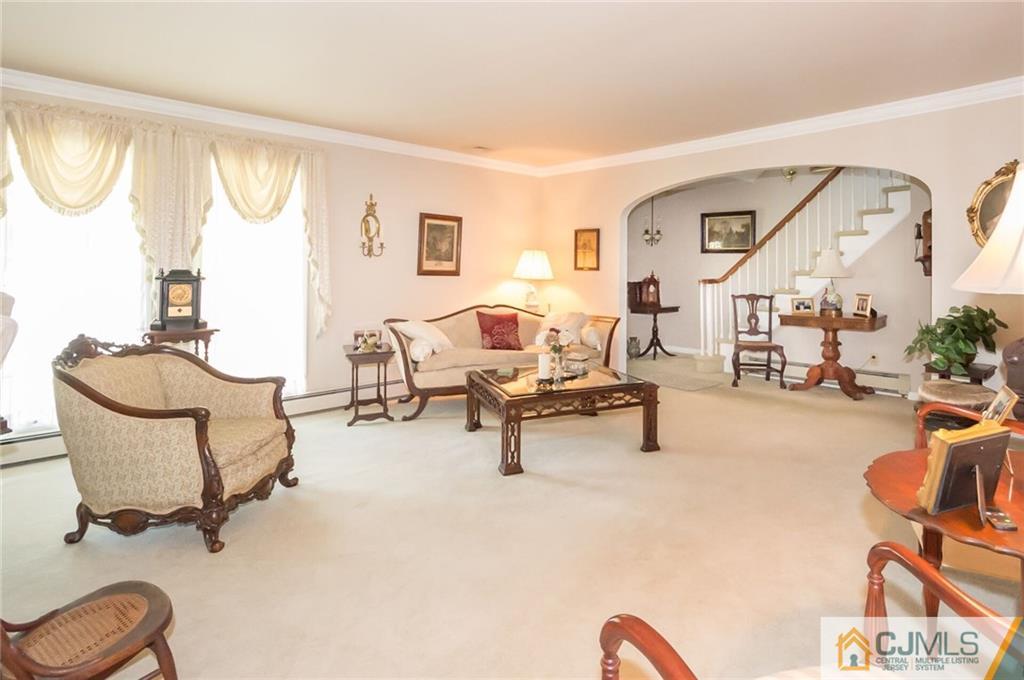 5 Utica Road Edison, NJ 08820 - Photo 3 of 48 a living room with furniture and a large window