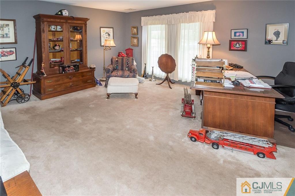 5 Utica Road Edison, NJ 08820 - Photo 23 of 48 a living room with furniture and a wooden floor